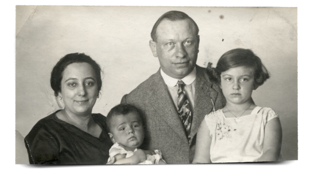 Formal family portrait of mother, father, Tomy and Iby in 1929